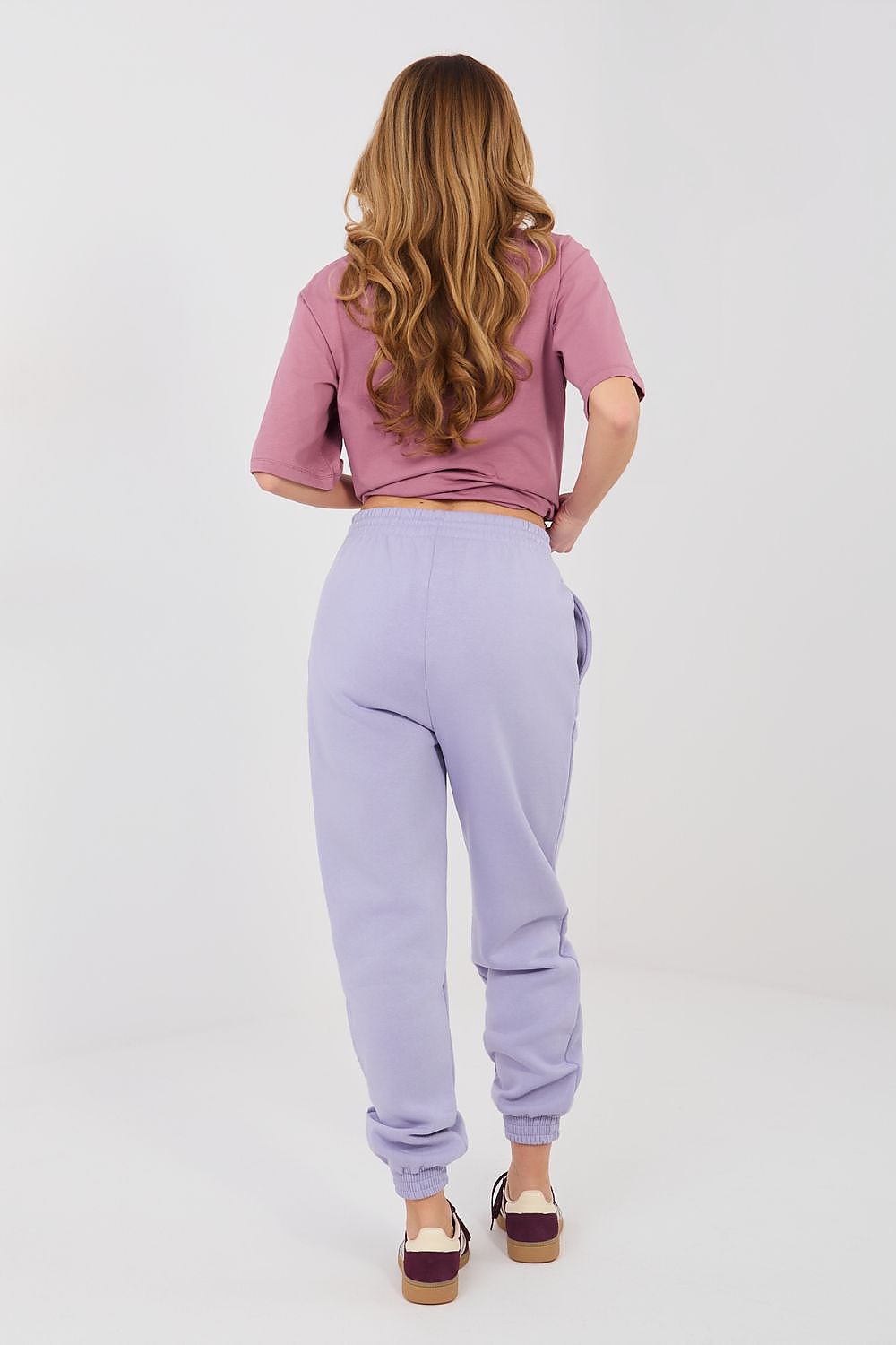 Lavender track jogger trousers with elastic cuffs and drawstring waist (back view)