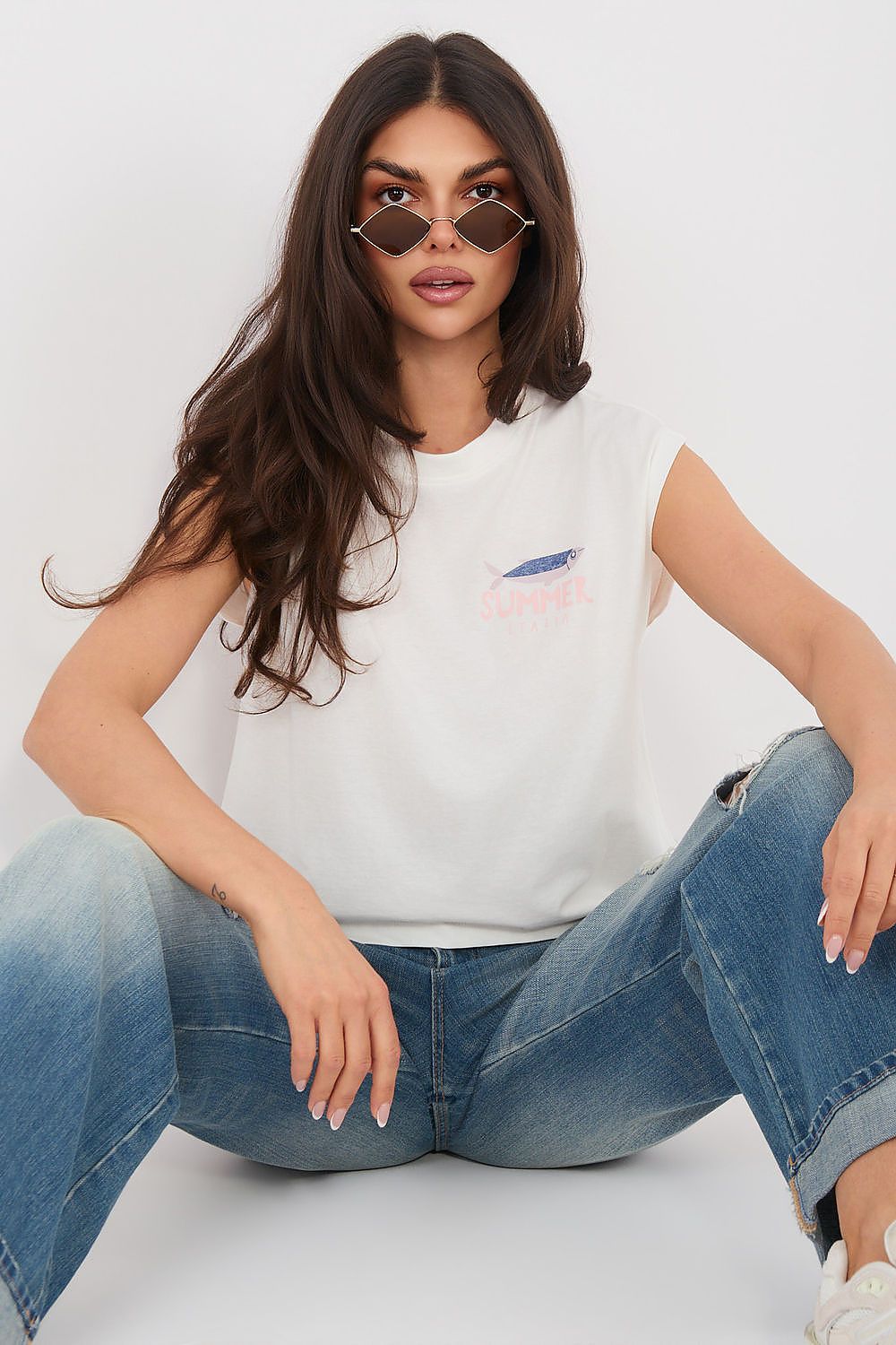 White crew-neck T-shirt with small chest graphic and short sleeves