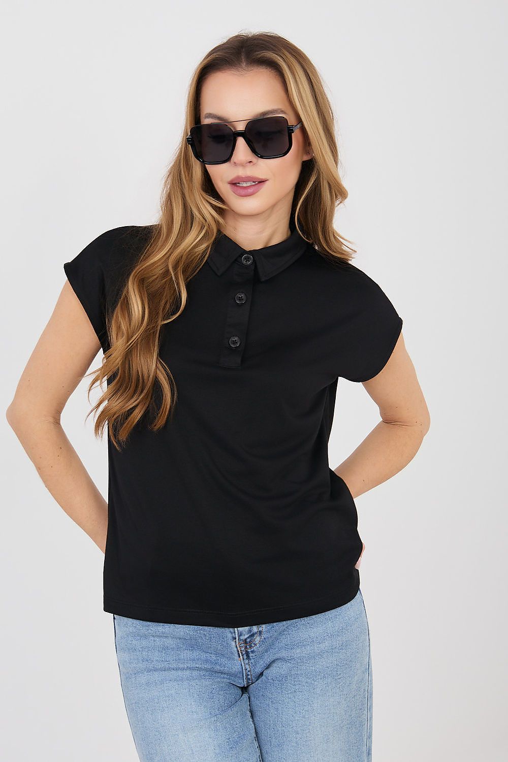 Black polo shirt with short sleeves and button placket