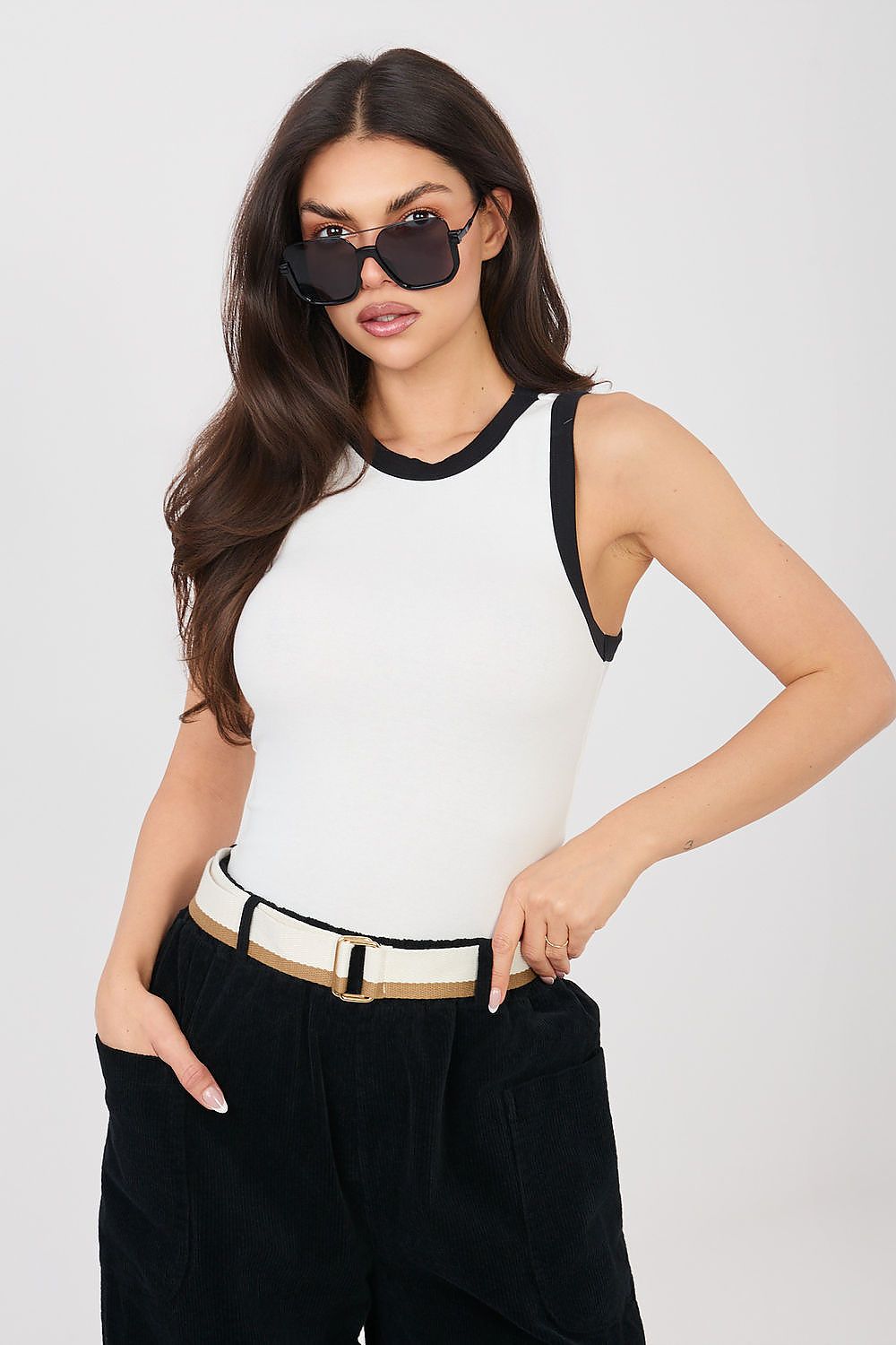 White sleeveless tank top with black crew neckline and armhole trim.