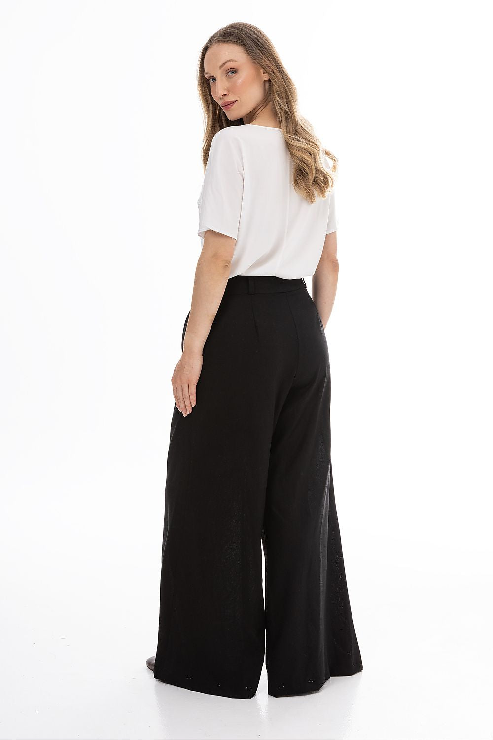 Awama women’s wide-leg trousers, black, back view with high waist and wide legs