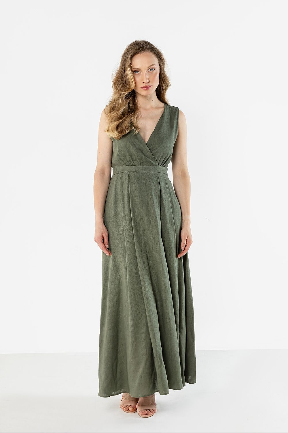 Green sleeveless maxi daydress with V-neck and gathered waist seam, flowing A-line skirt