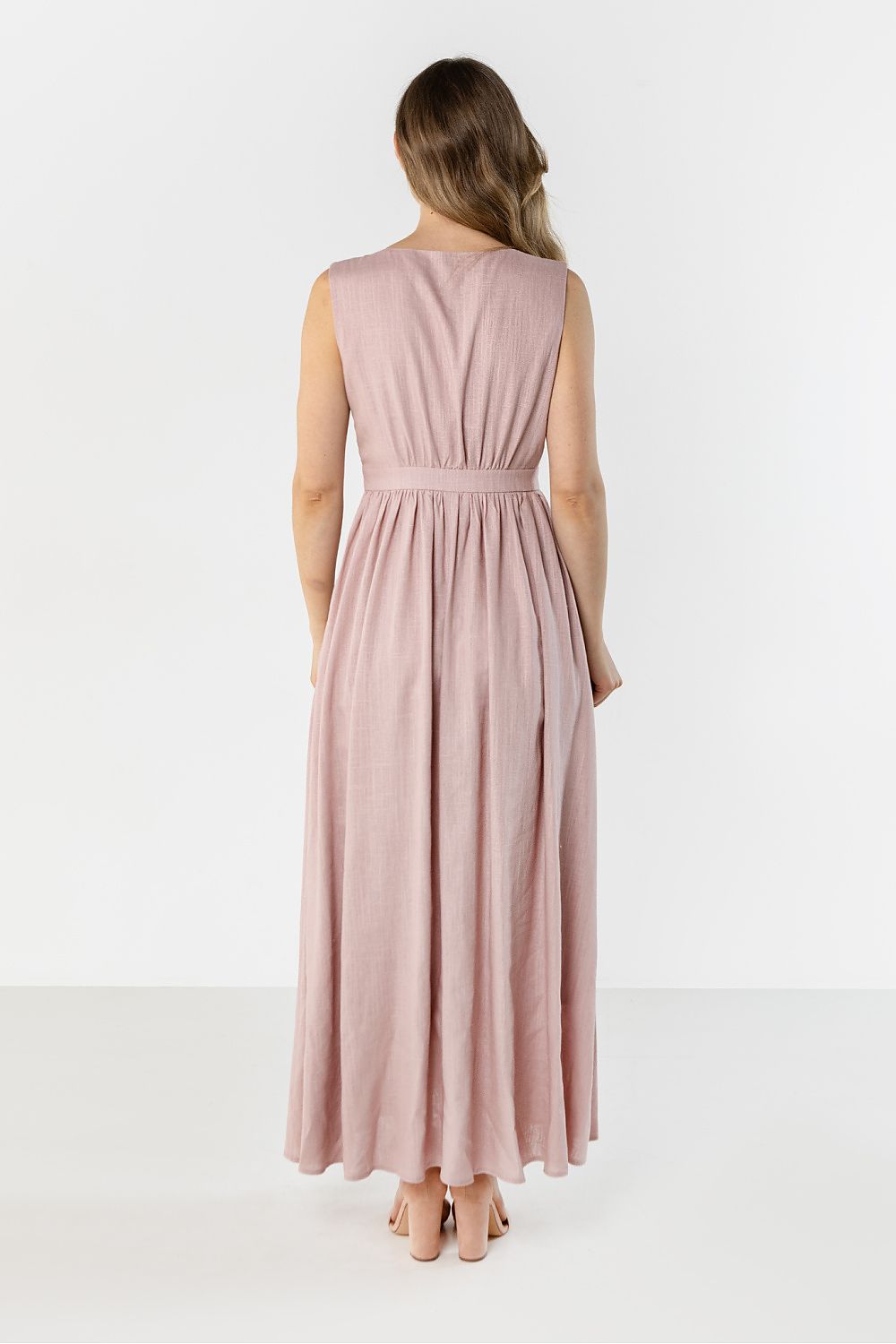 Pink sleeveless maxi daydress with gathered waist and flowing skirt, back view