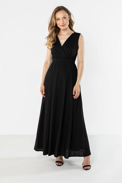 Black sleeveless maxi daydress with V-neck wrap styling and gathered waist seam, front view