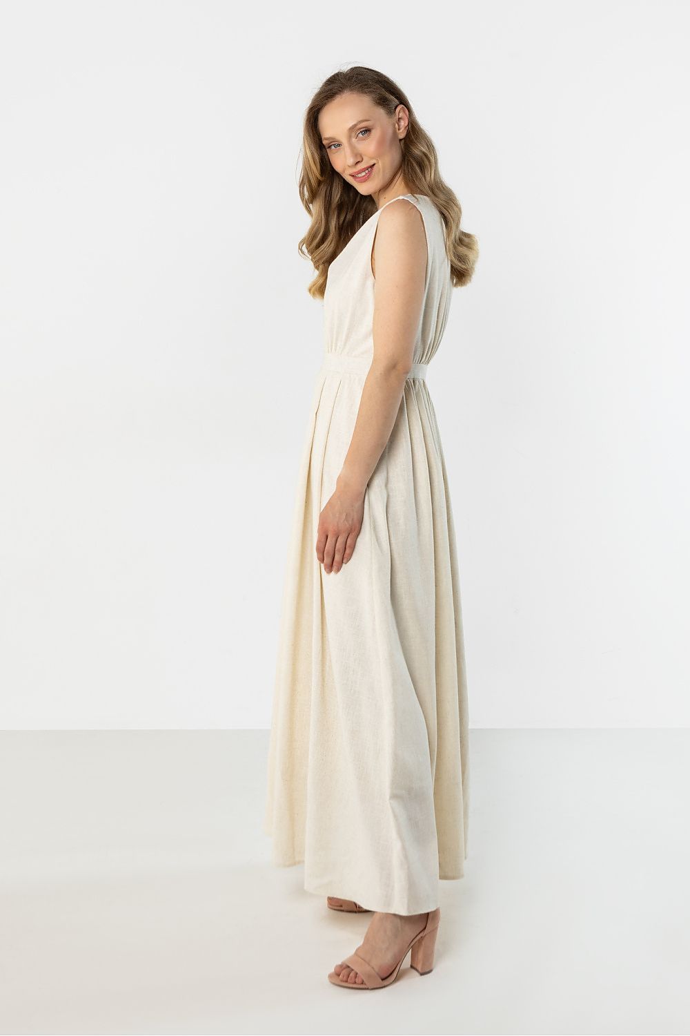 Sleeveless midi day dress in light beige, scoop neckline, gathered waist, full skirt