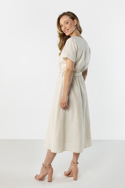 Light beige day dress with short sleeves and gathered waist, side view