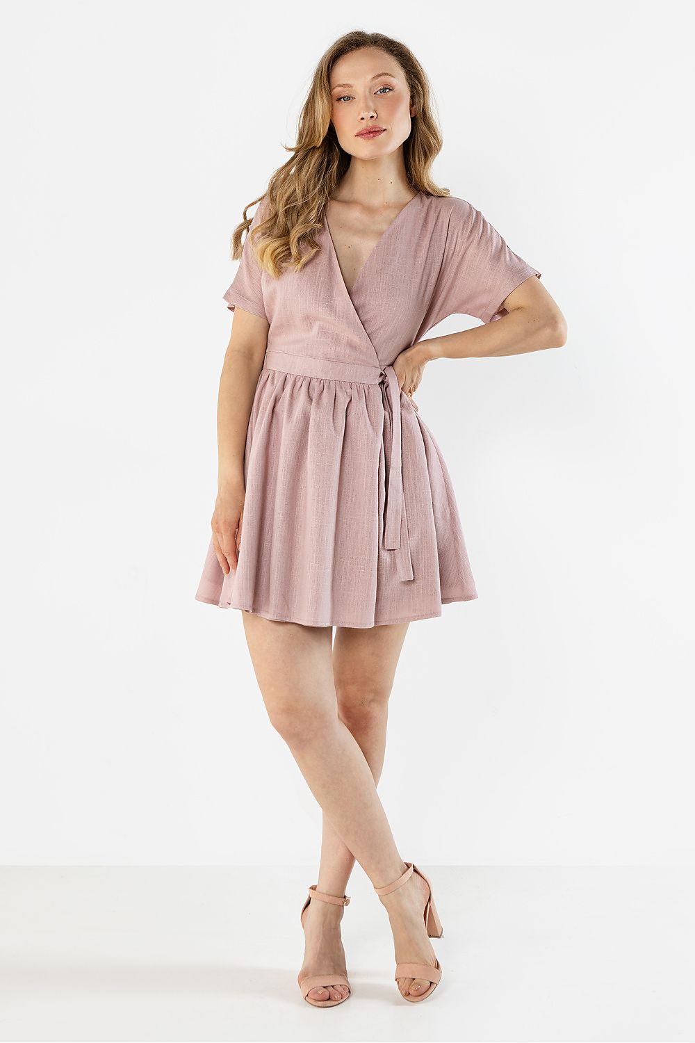 Blush pink short-sleeve daydress with V-neck, waist tie and flared skirt