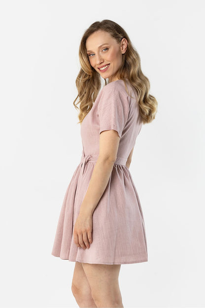 Blush pink short-sleeve daydress with tied waist and flared A-line skirt