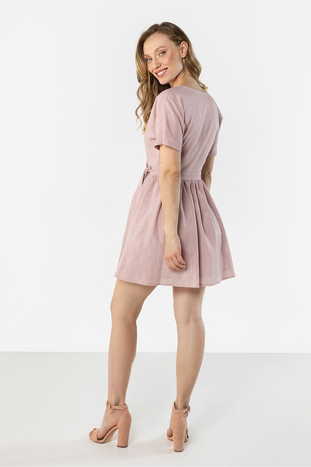 Blush pink short-sleeve daydress with tied waist and gathered skirt