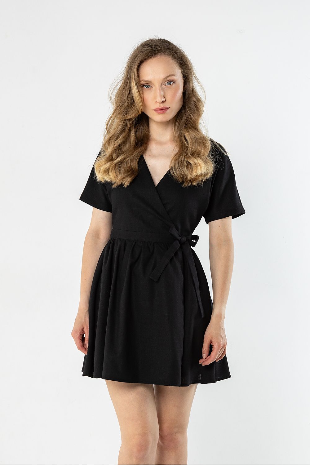 Black short-sleeve daydress with V-neck and tied waist, flared skirt