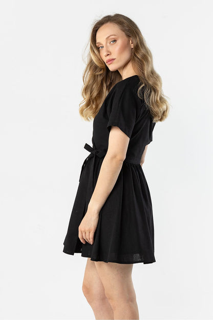 Black short-sleeve daydress with tie-bow waist and gathered flared skirt