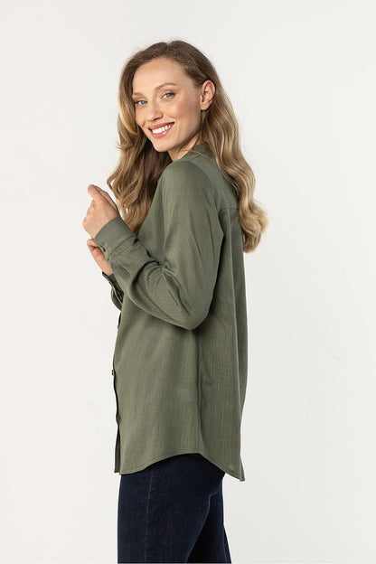 Awama long-sleeve shirt in olive green, side view with button placket and cuffs