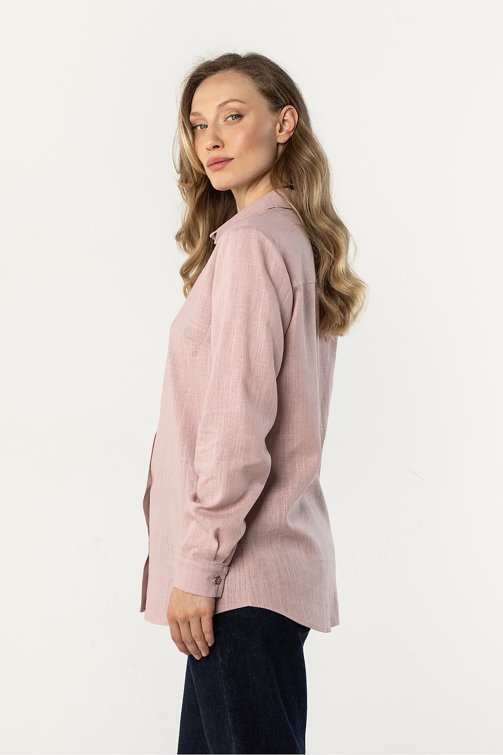 Awama long-sleeve shirt in dusty pink, side view with button placket and cuffs