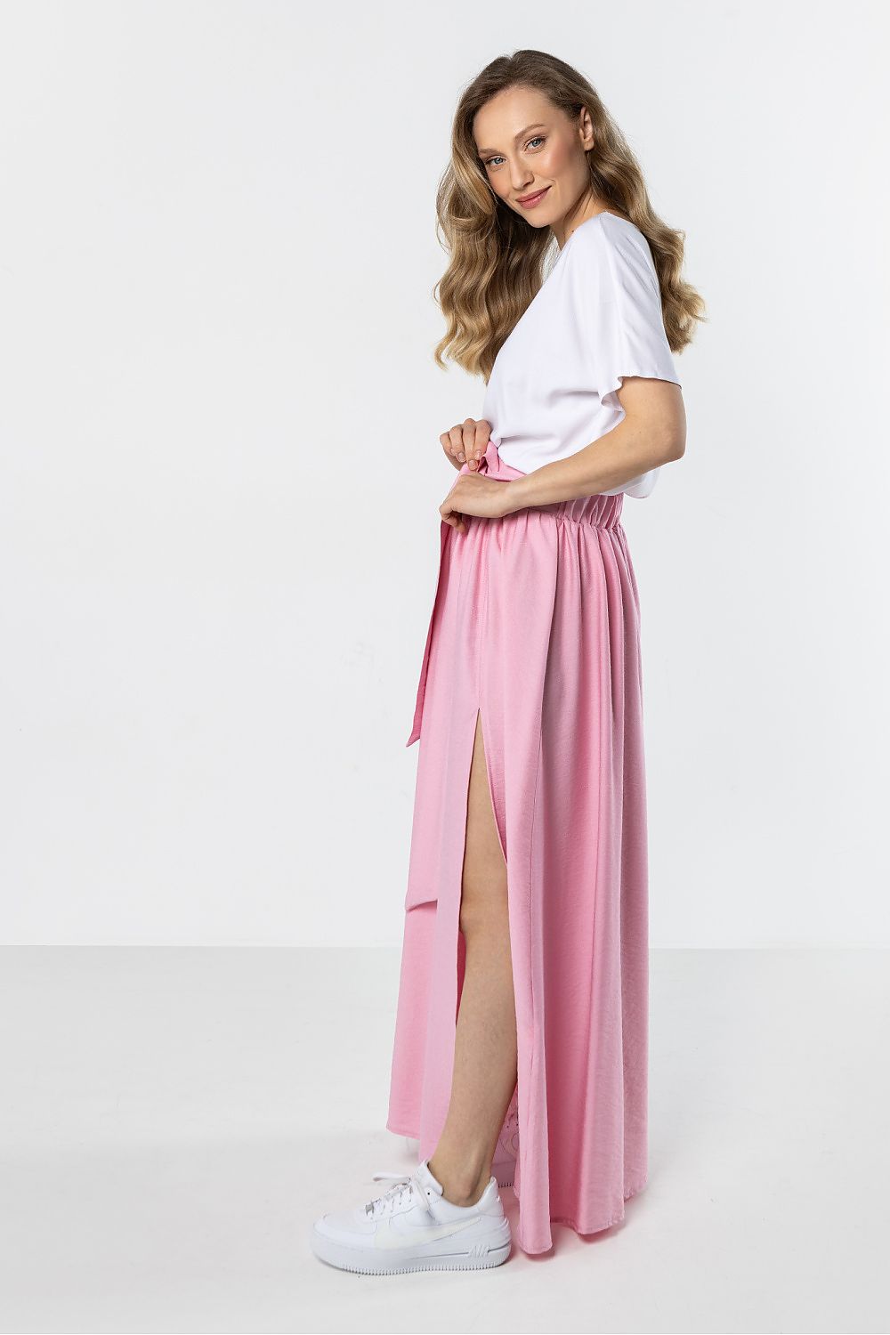 Long dusty pink skirt with gathered waist and front leg-opening slit