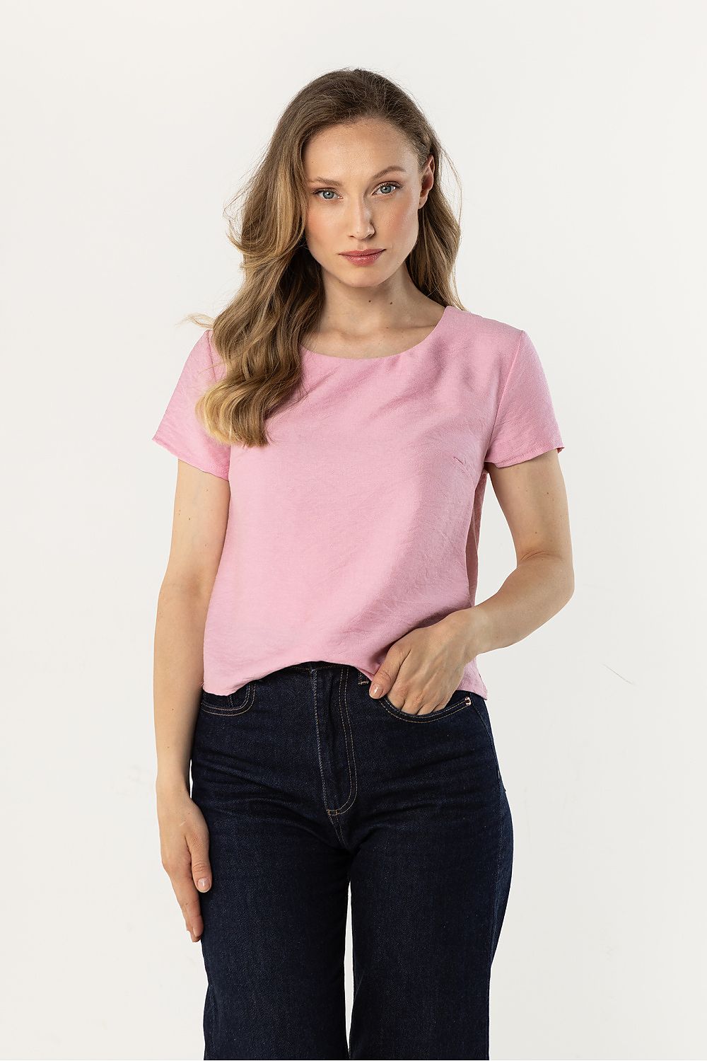 Pink short-sleeve crewneck blouse with smooth fabric and relaxed fit