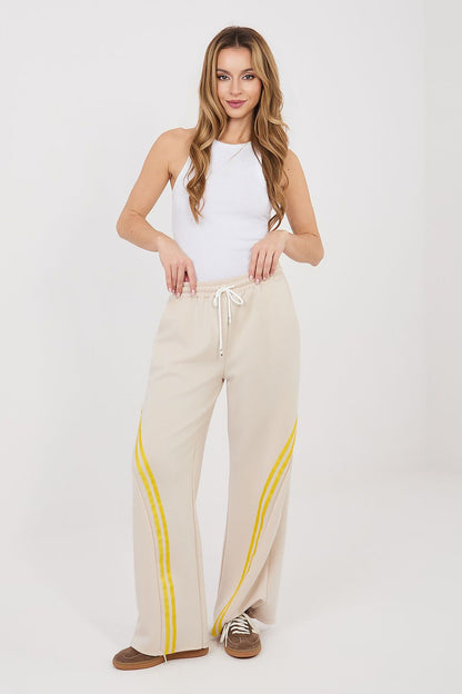 Tracksuit trousers, light beige with yellow side stripes, drawstring elastic waist, wide legs