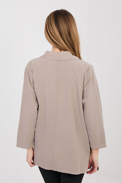Back view of taupe long sleeve shirt with button placket and three-quarter sleeves