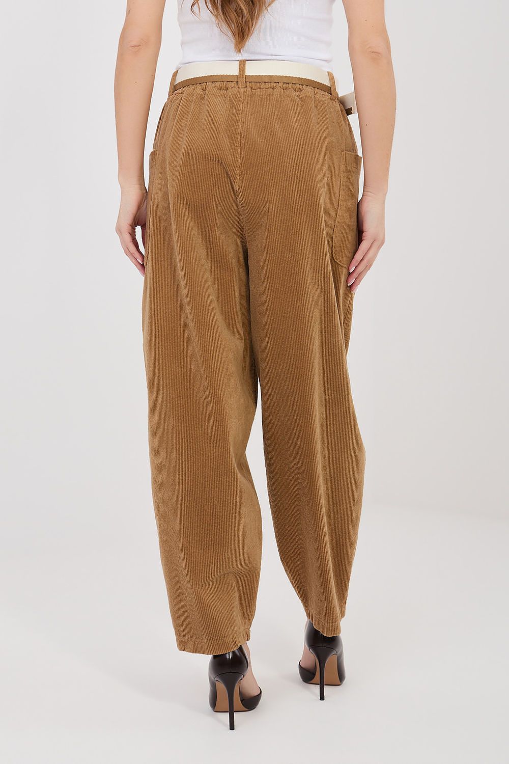 Brown corduroy trousers with high waist, pleat front, and side pockets