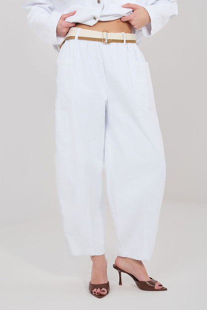 White corduroy trousers with high waist, belt loops, and side pockets, ankle length