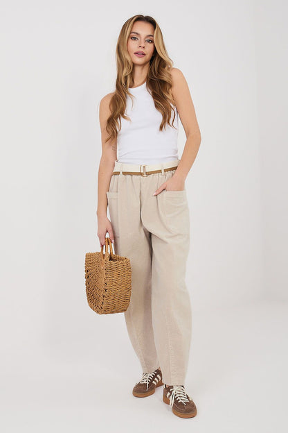 Beige corduroy trousers with high waist, belt loops, and side pockets