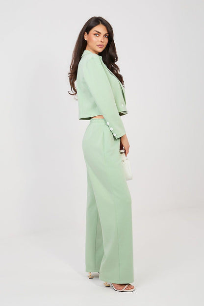 Mint green two-piece set with cropped jacket and wide-leg trousers, side view