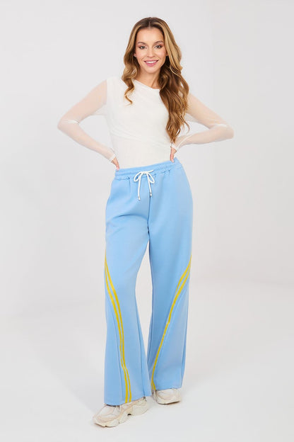 Light blue track pants with drawstring waist and yellow side stripes