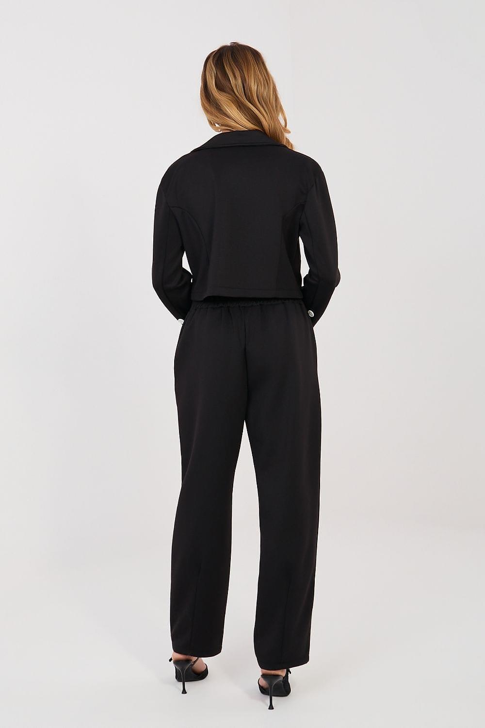 Black two-piece pantsuit set with long-sleeve jacket and tapered trousers, back view