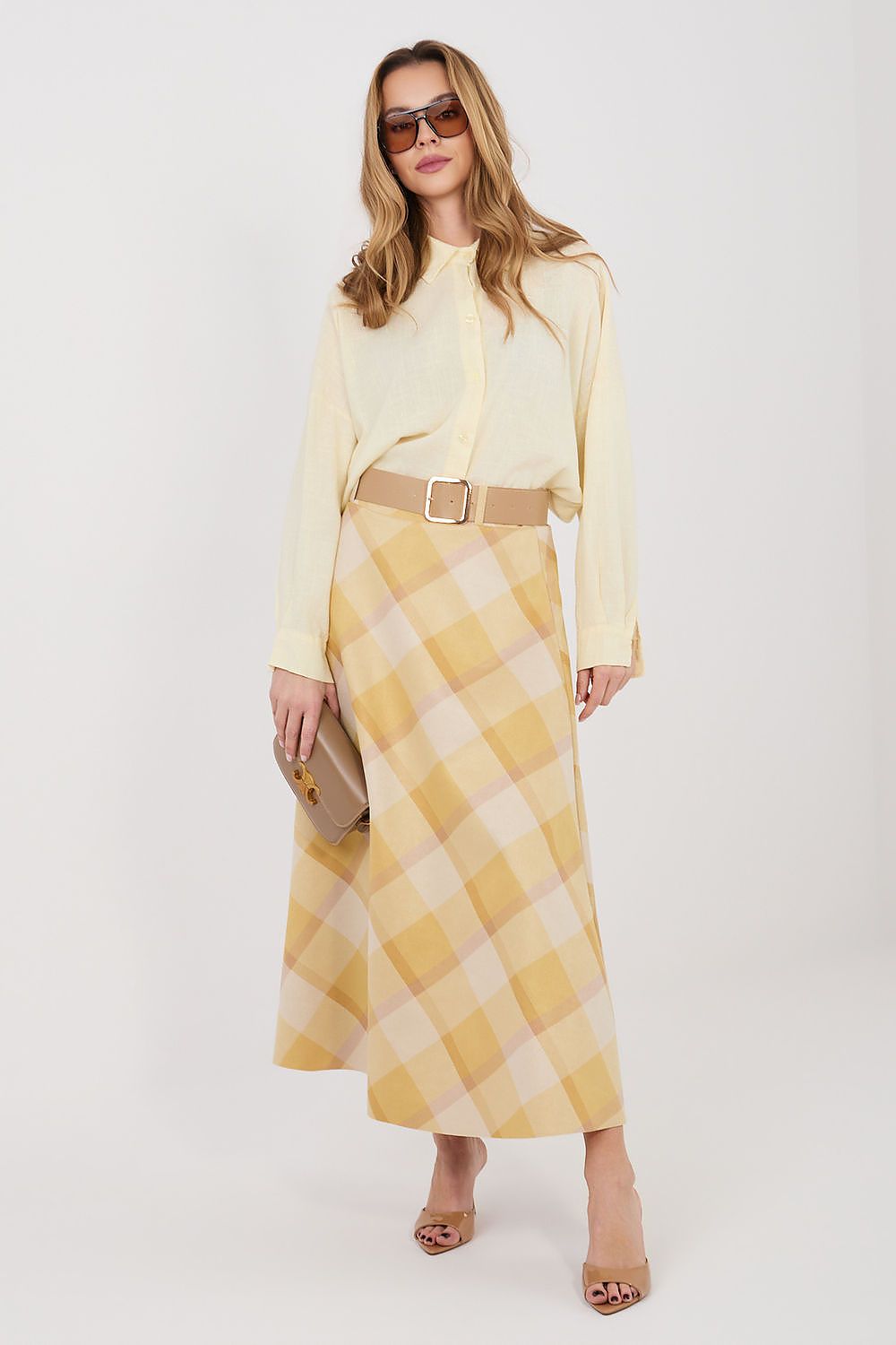 Yellow and cream check long skirt with tan belt and gold buckle at waist