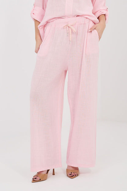 Women’s pink linen-look drawstring wide-leg trousers with side pockets and relaxed fit