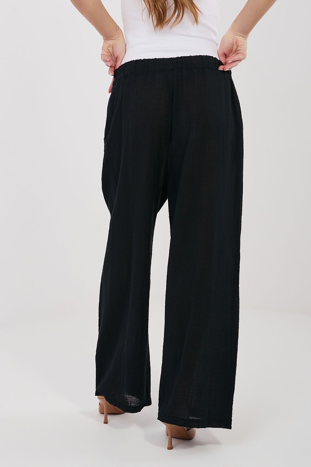 Women’s black wide-leg trousers with elastic waistband and relaxed drape
