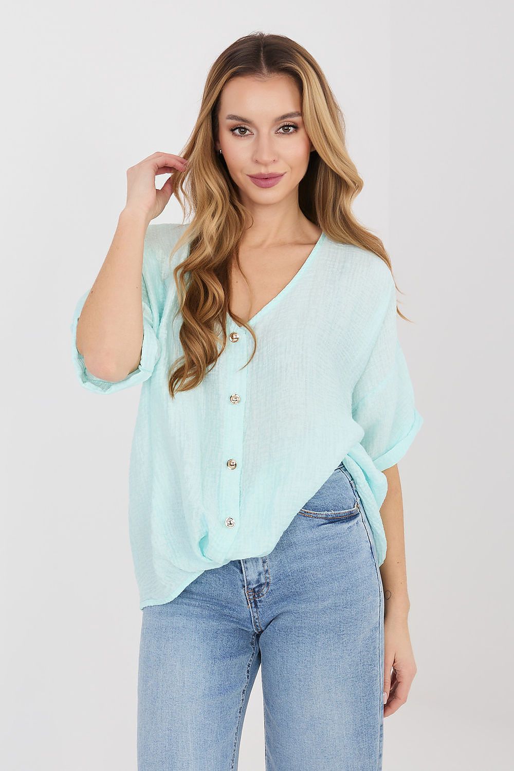 Light blue short-sleeve V-neck button shirt with small gold buttons