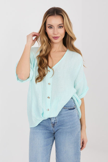 Light blue short-sleeve V-neck button shirt with small gold buttons