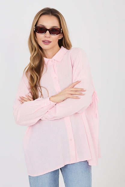 Pink long-sleeve button-front shirt with pointed collar and long sleeves