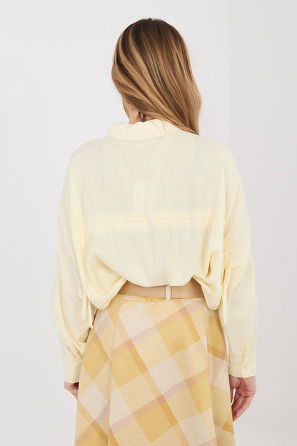 Light yellow long-sleeve shirt back view with tied cuff details and full button placket
