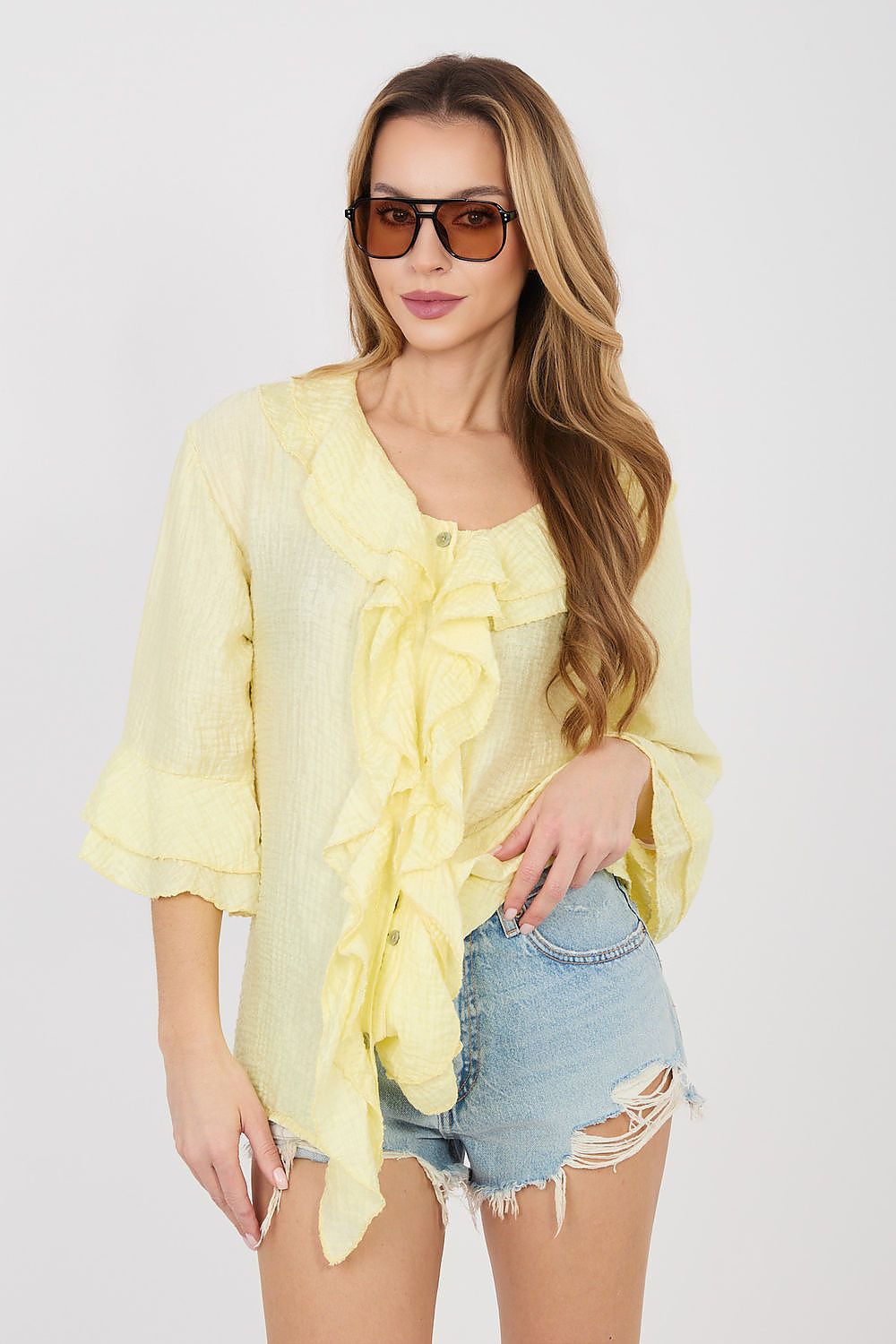 Yellow long-sleeve ruffle shirt with button front and gathered bib neckline