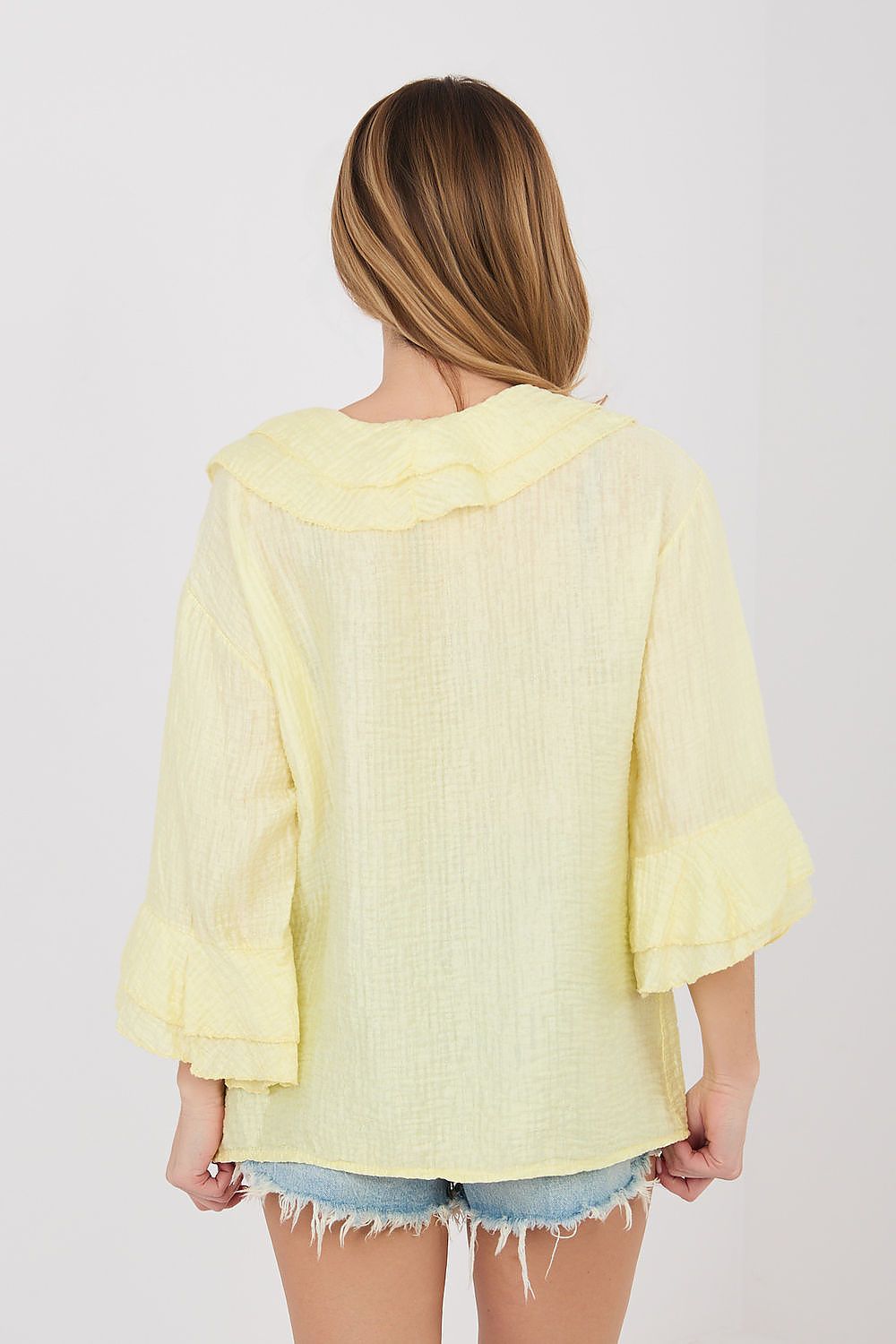 Yellow long-sleeve ruffle-back shirt with hooded collar and button placket