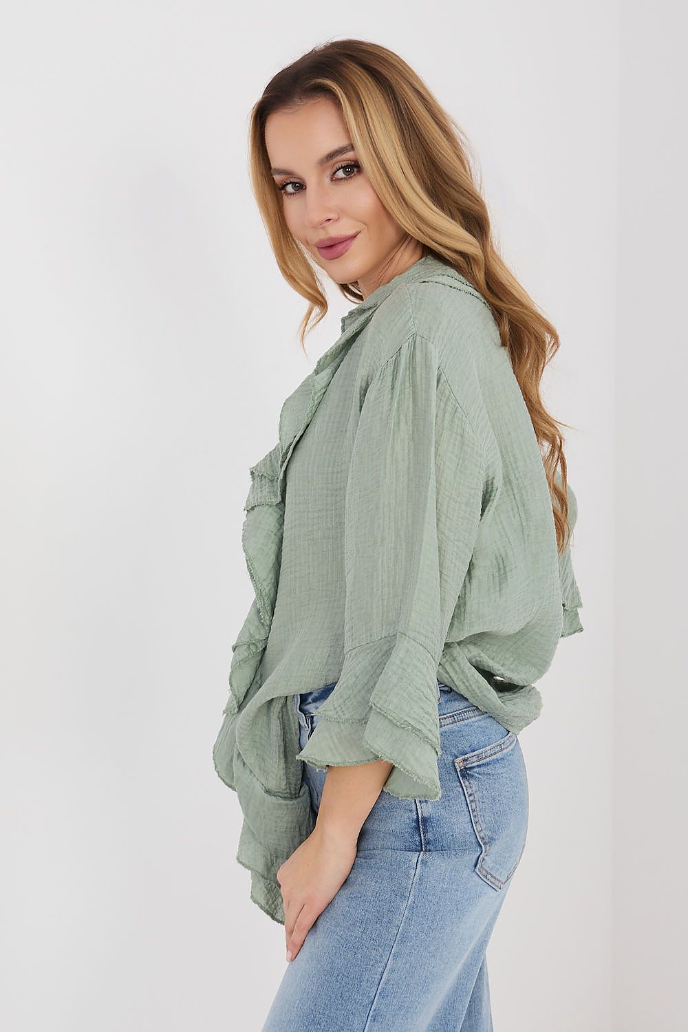 Green long sleeve shirt with ruffled shoulder and cuffed tiered sleeves