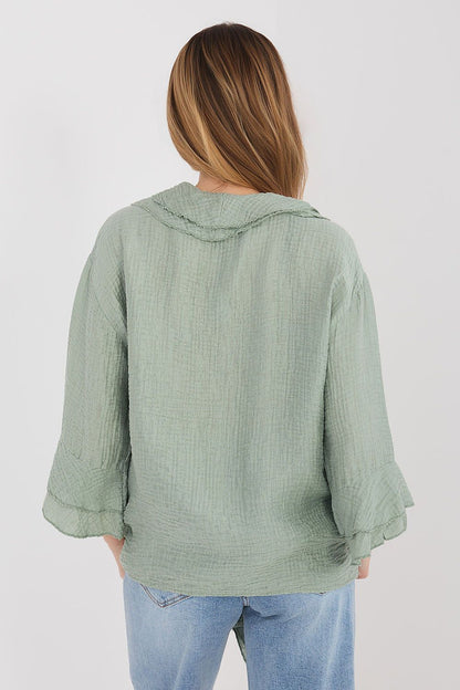 Green long sleeve shirt with back yoke seam and ruffled cuffs