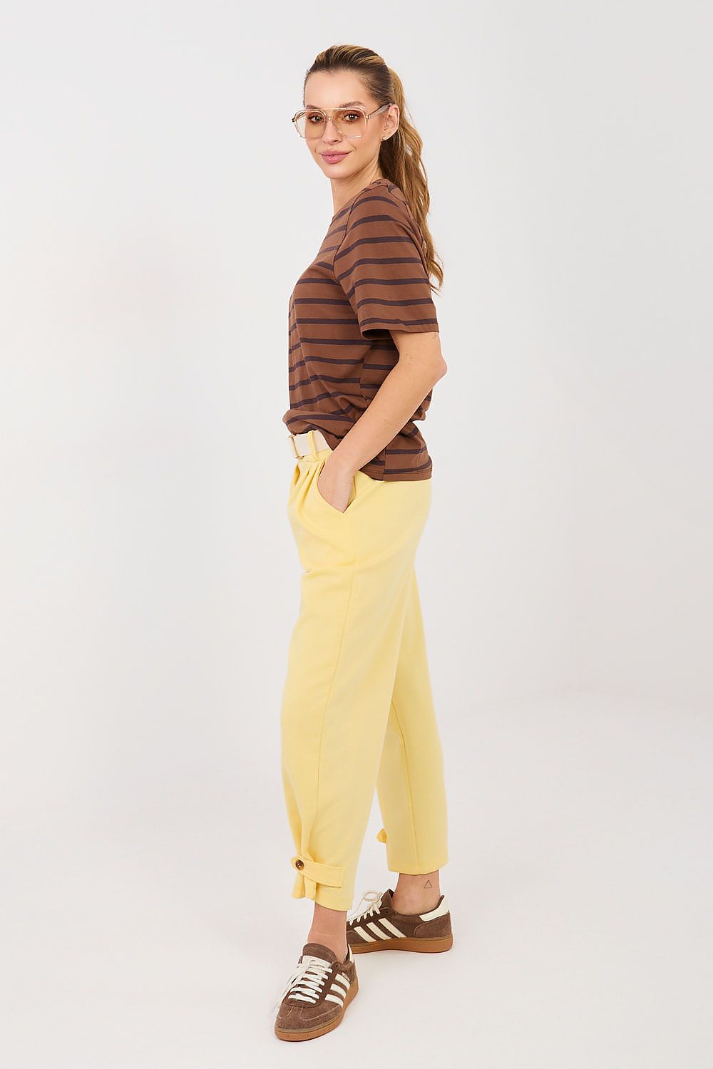 Yellow track pants, relaxed straight legs with gathered ankle cuffs