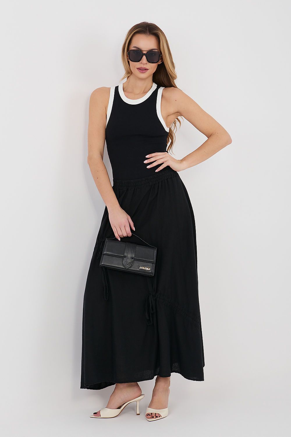 Black long skirt with elastic waistband and gathered tiers, lace hem