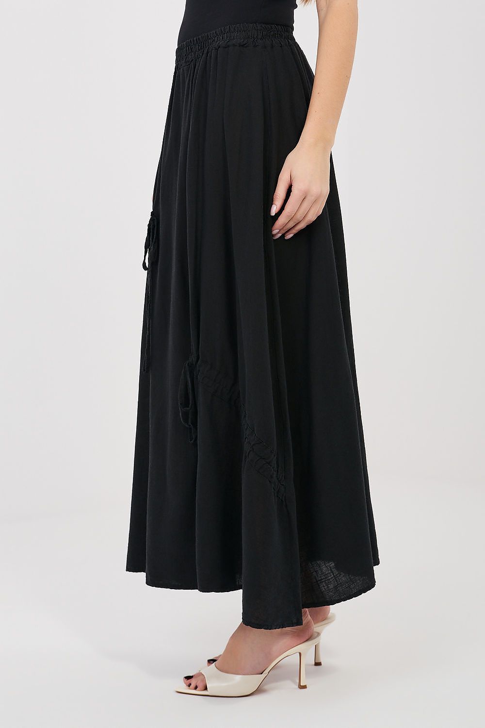 Black long skirt with elastic waistband and drawstring ties at the sides