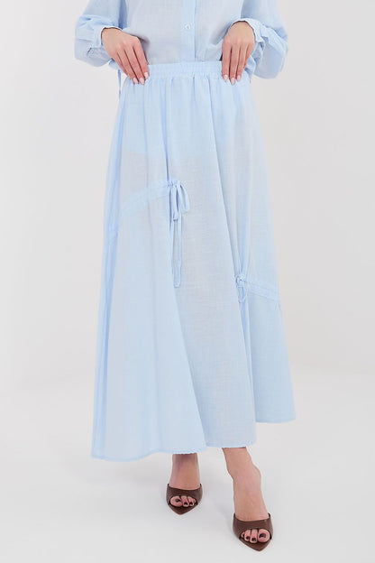 Light blue long skirt with elastic waist and drawstring tie pockets, midi length