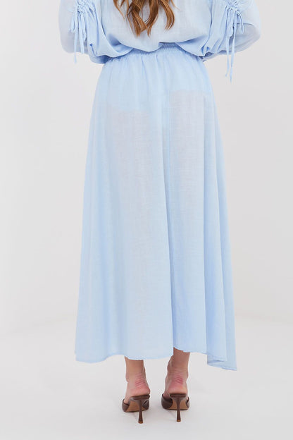 Light blue long skirt with elastic waist and flowing pleats, midi length