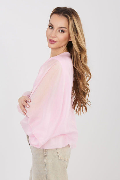 Pink long-sleeve blouse with round neckline, side view