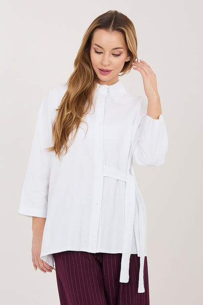 White long sleeve shirt with button front and waist tie, asymmetrical hem
