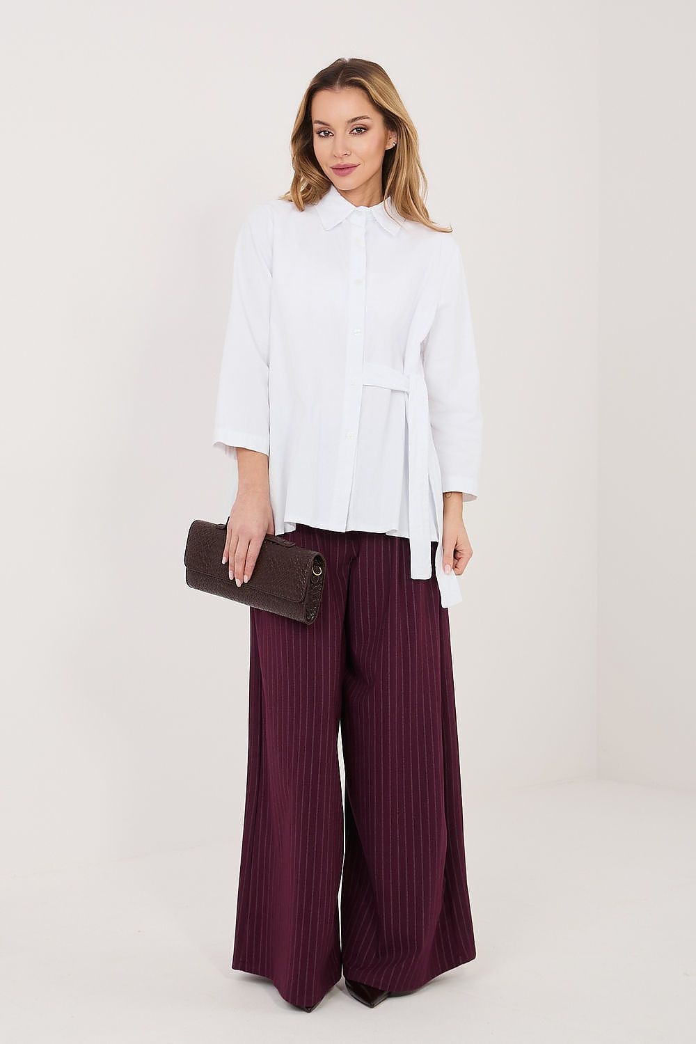 White long sleeve shirt with button front and side waist tie, layered asymmetrical hem