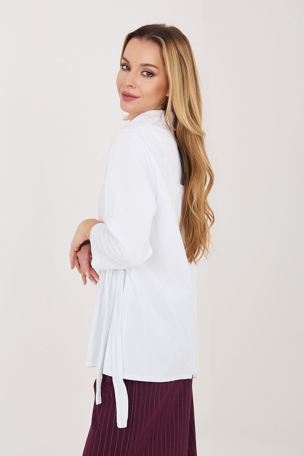 White long sleeve shirt side view with button placket and waist tie strings