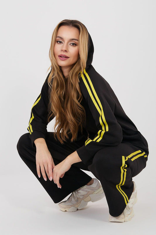 Black tracksuit set with hooded top and wide-leg pants, neon yellow stripe detail