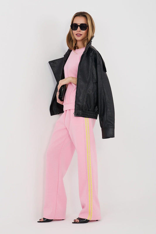 Pink two-piece pants set with matching sweatshirt and yellow side stripe