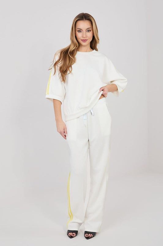 Two-piece off-white set: short-sleeve top and pants with yellow side stripes